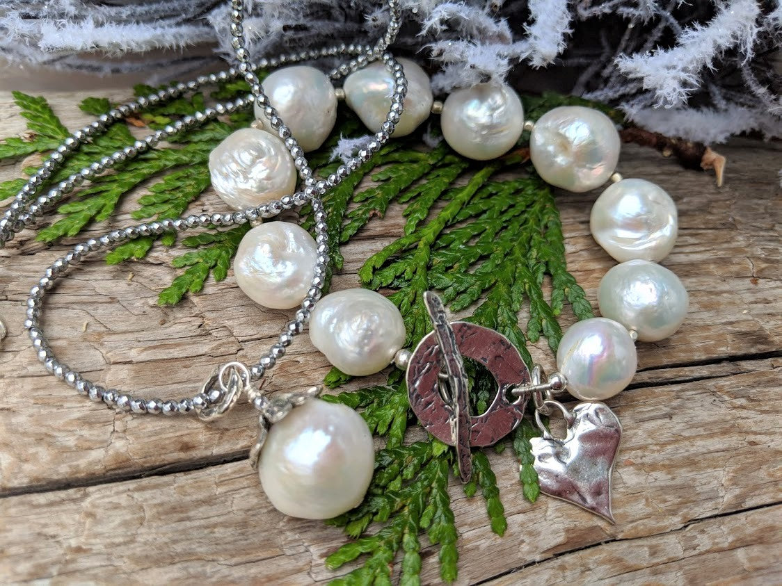 Thin silver hematite gemstone and large white Edison pearl pendant necklace by Aurora Creative Jewellery