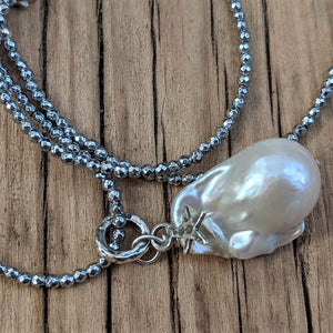 Thin silver hematite and large white baroque pearl pendant necklace with star charm, by Aurora Creative Jewellery