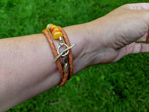 Egg Yolk amber wrap leather bracelet, Butterscotch amber wrap bracelet.  Amber & Gold Bronze bracelet. Toggle bracelet. Handcrafted by Aurora Creative Jewellery.