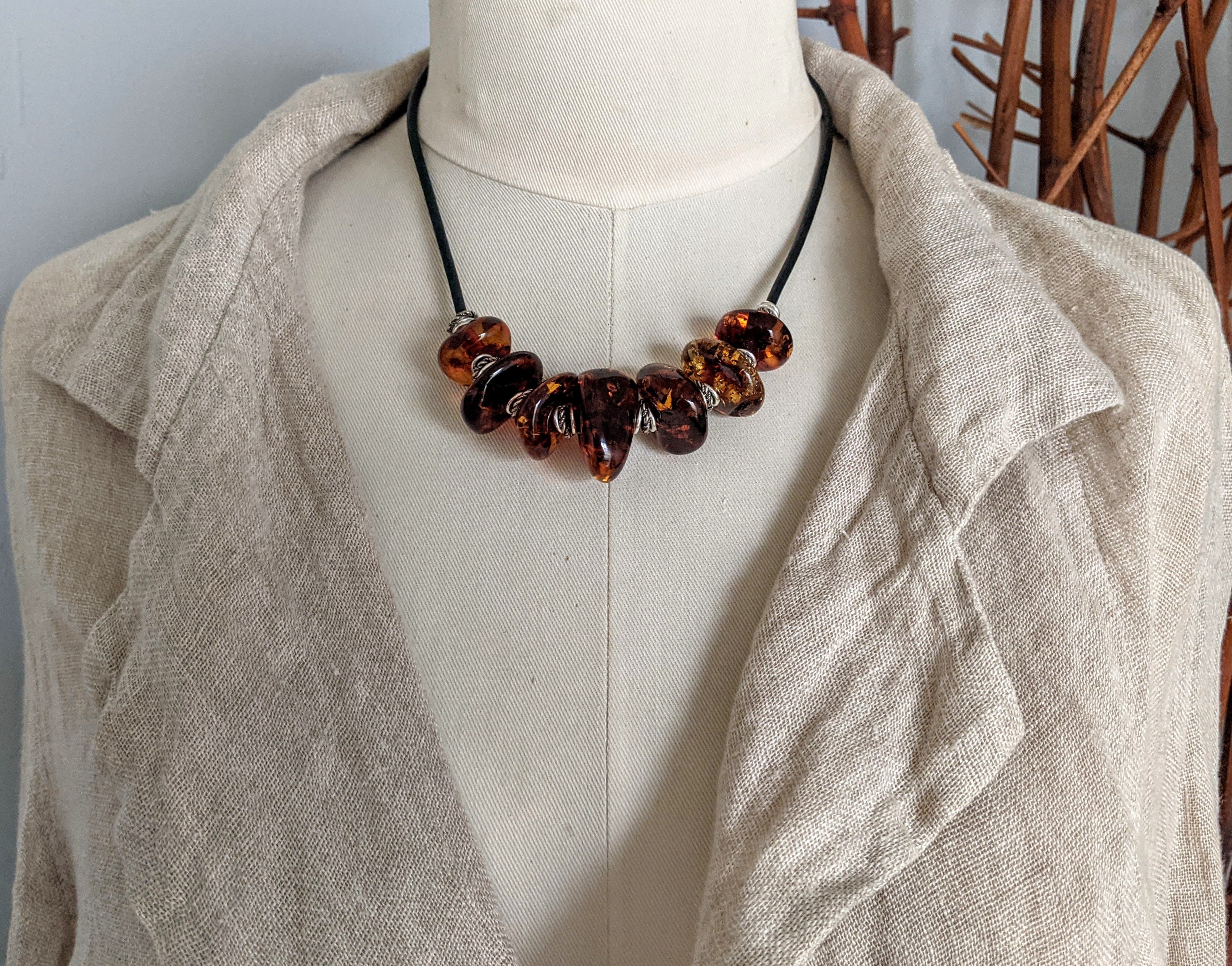 Amber leather statement necklace. Organic earthy jewelry. Handcrafted by Aurora Creative Jewellery. 