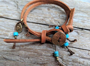 This fun handmade artisan boho leather wrap bracelet showcases the beauty of natural textures. The vibrant natural turquoise gives a pop of color on the background of natural leather.  The bracelet is finished off with a gold bronze button and leather loop. A heart charm adds another touch of gold and an element of fun. The heart charm can freely move around the bracelet so you can enjoy it from all sides. 