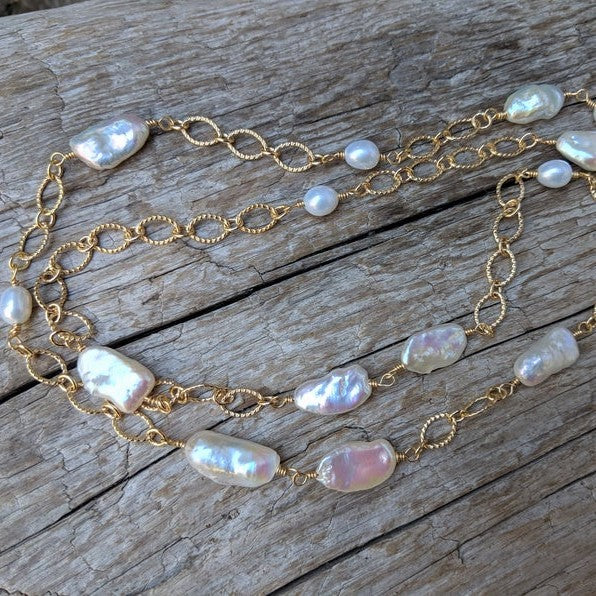 Long thin baroque pearl & gold chain necklace by Aurora Creative Jewellery