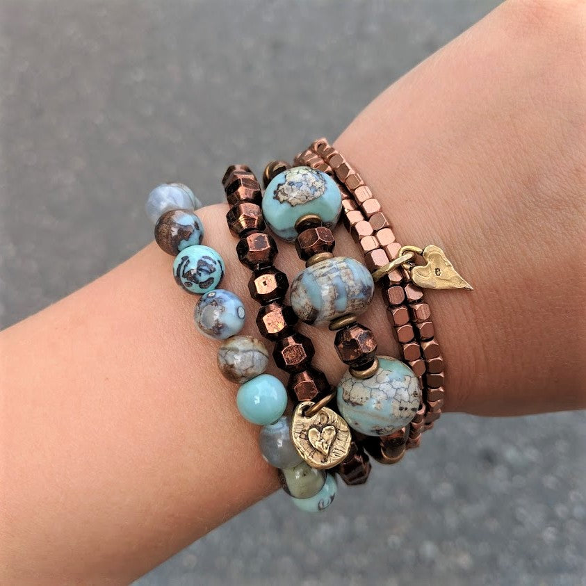 Faceted antique copper stacking geometric bracelet with artisan gold bronze heart charm by Aurora Creative Jewellery