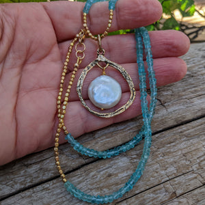Aqua blue apatite gemstone artisan necklace with big pearl pendant. Handcrafted by Aurora Creative Jewellery.