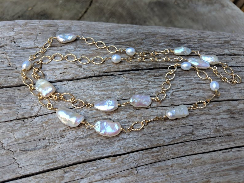 Long thin baroque pearl & gold chain necklace by Aurora Creative Jewellery