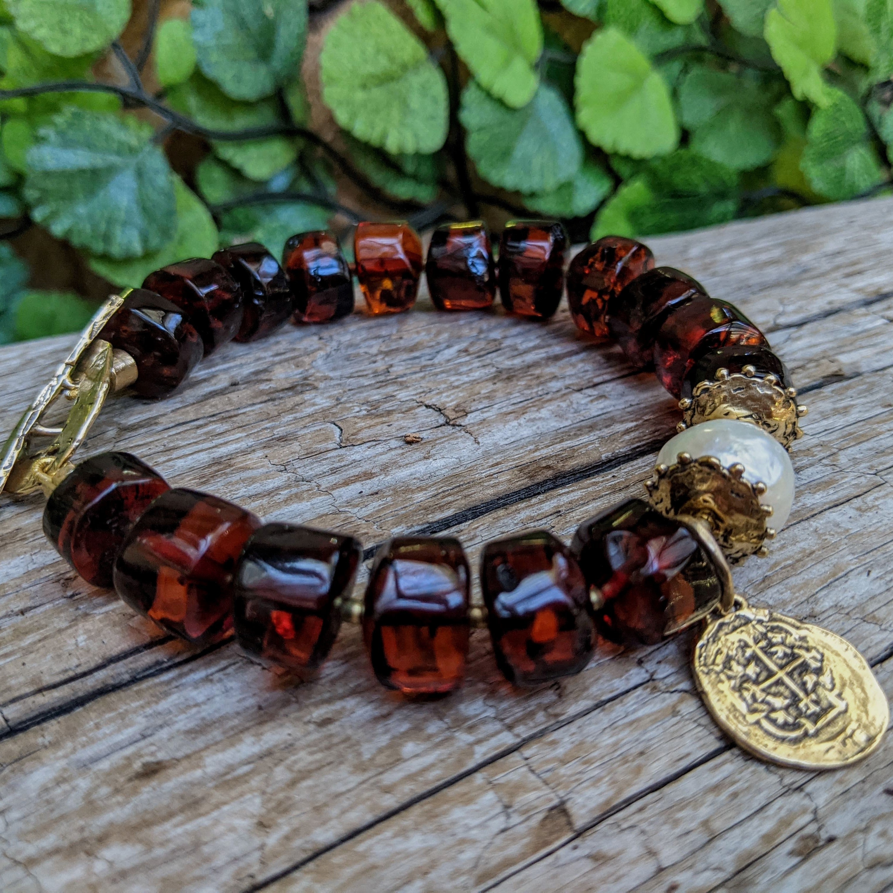Handmade rustic bracelet with Baltic amber and gold bronze Spanish charm and big white Edison pearl handcrafted by Aurora Creative Jewellery