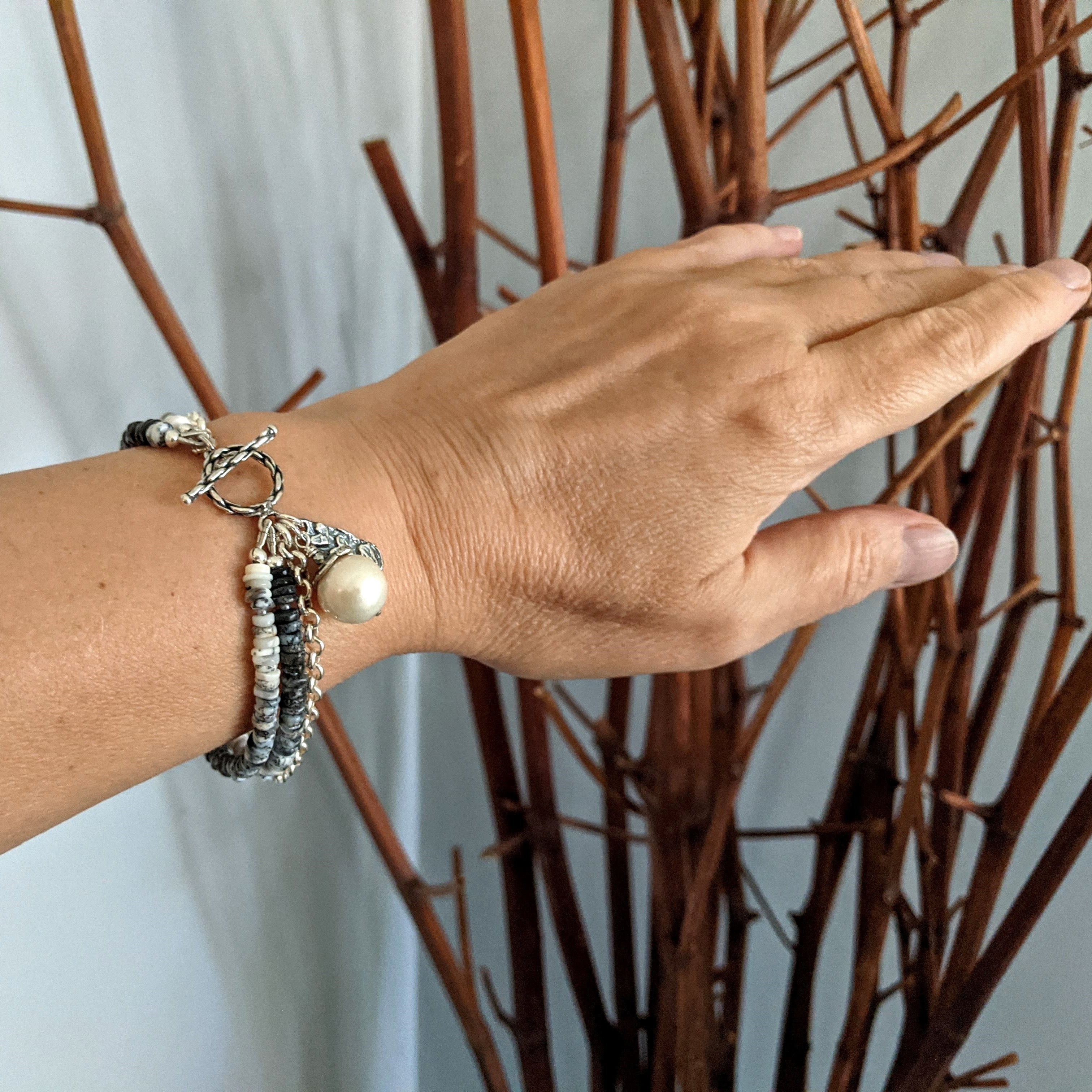 Handmade artisan grey gemstone bracelet with dendritic opal, white Edison pearl and sterling silver. Multi strand bracelet handcrafted by Aurora Creative Jewellery.