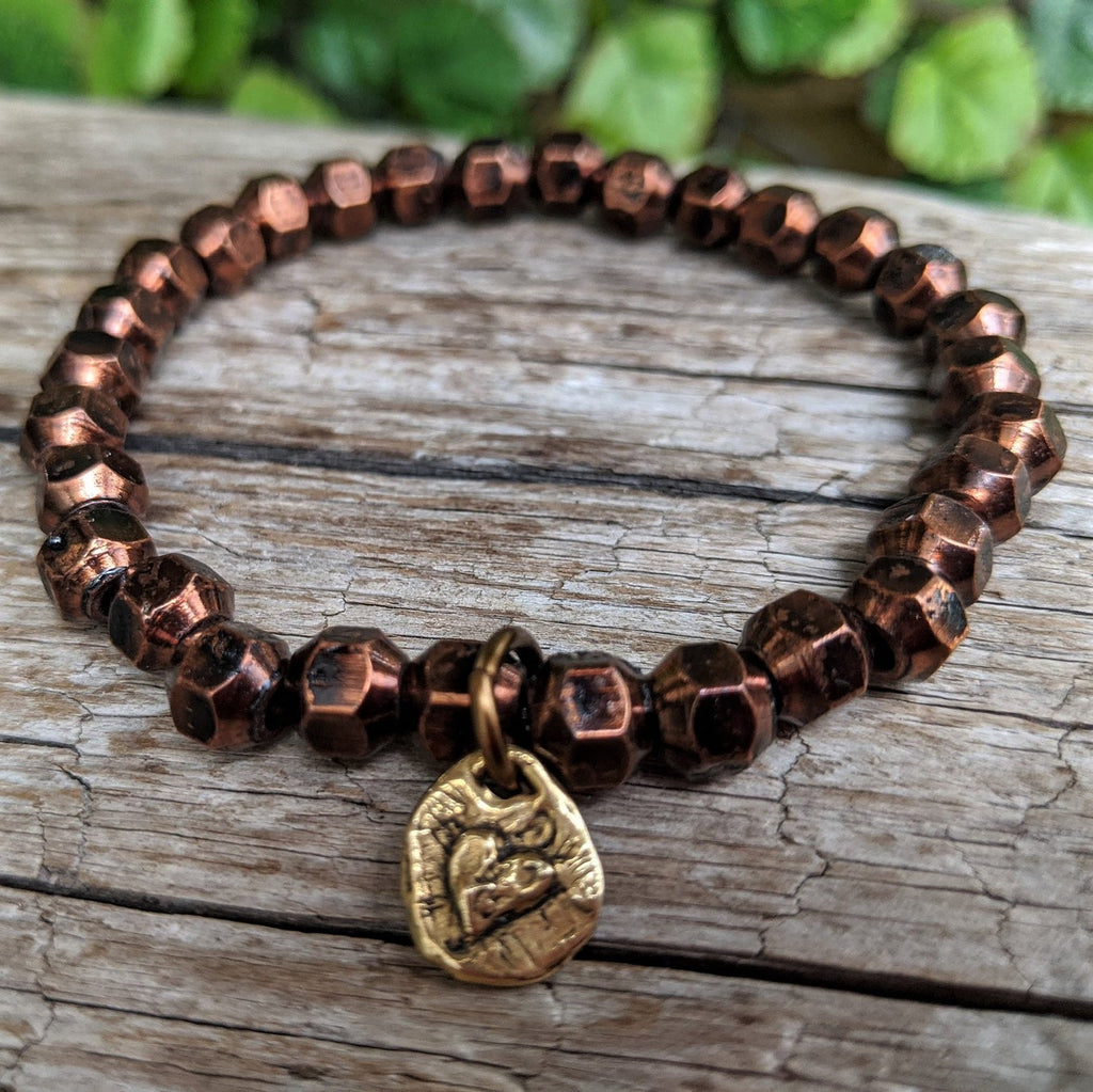 Faceted antique copper stacking geometric bracelet with artisan gold bronze heart charm by Aurora Creative Jewellery