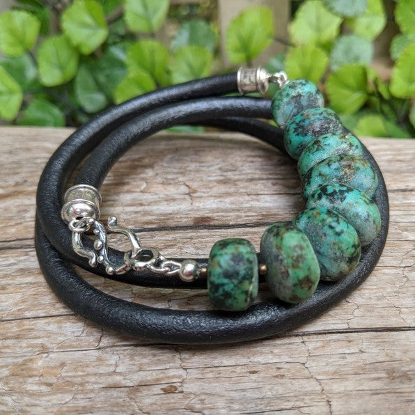 Matte turquoise gemstone and black leather men's wrap bracelet with sterling silver hook. Designed and handmade by Aurora Creative Jewellery