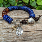Lapis lazuli bracelet with Baltic amber , sterling silver and gold bronze.
