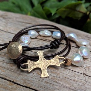 Large white pearl black leather bracelet with gold bronze cross and button, by Aurora Creative Jewellery