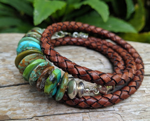 This handmade artisan turquoise and leather wrap bracelet is a chic and bright accessory that makes a statement. The beautiful rich earth colors of turquoise are complimented by brown leather and sterling silver elements. The leather is thick, but feels soft to the touch and is comfortable to wear. Wearing this bracelet feels like taking a nature walk in the forest and absorbing the beauty of natural organic colors and textures.
