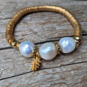 Three large white pearls elastic bracelet with pine cone charm and gold African brass by Aurora Creative Jewellery