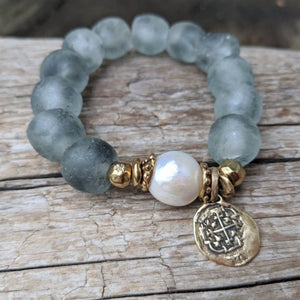 Handmade artisan large white pearl bracelet with gray blue recycled glass and gold bronze heart charm by Aurora Creative Jewellery