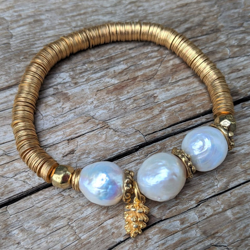 Three large white pearls elastic bracelet with pine cone charm and gold African brass by Aurora Creative Jewellery