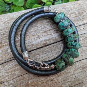 Matte turquoise gemstone and black leather men's wrap bracelet with sterling silver hook. Designed and handmade by Aurora Creative Jewellery
