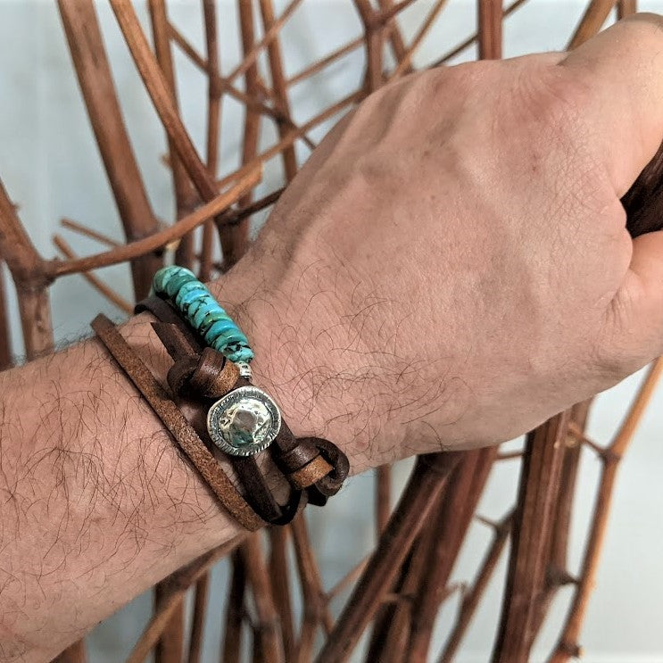 Turquoise gemstone and brown leather wrap bracelet for men. The bracelet has a rough chunky and asymmetrical look making it a perfect bracelet for men or a unisex accessory for the lovers of a chunky natural look. Designed and handcrafted by Aurora Creative Jewellery.