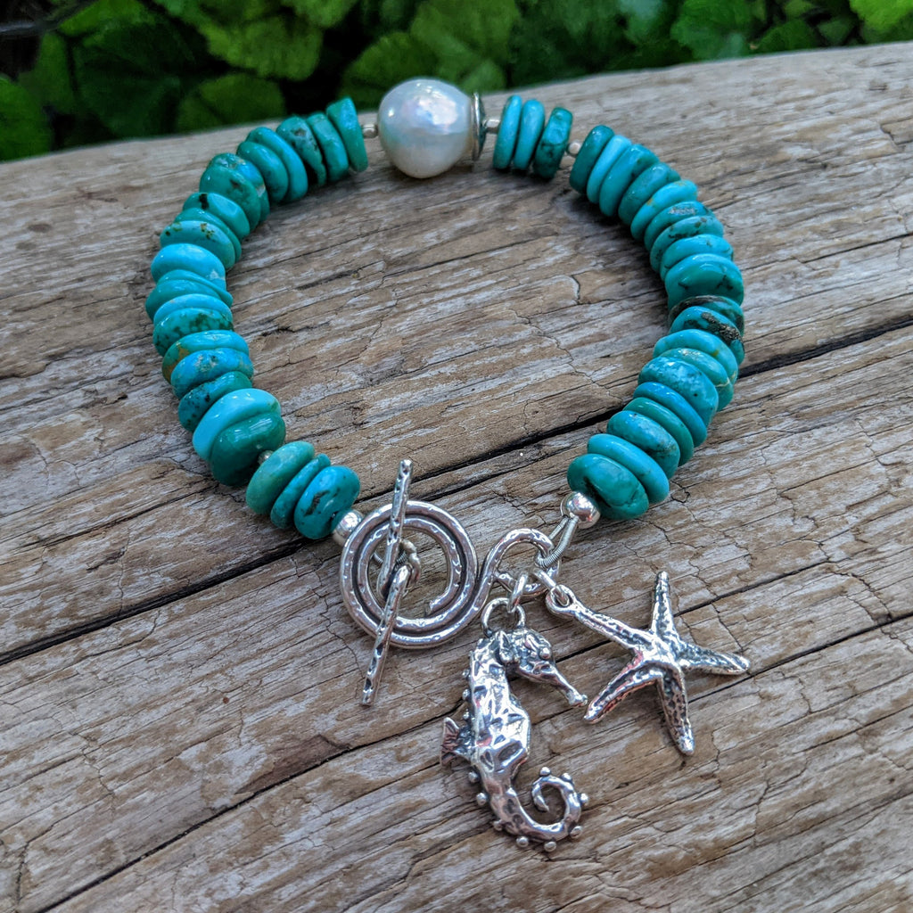 Genuine turquoise bracelet with sea horse, sea star charms. Turquoise bracelet with big Edison pearl. Ocean theme bracelet. Boho, Bohemian bracelet. Handcrafted by Aurora Creative Jewellery.