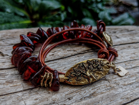 Cognac brown Baltic amber and leather wrap bracelet with gold bronze tree linker and tiny heart charm by Aurora Creative Jewellery