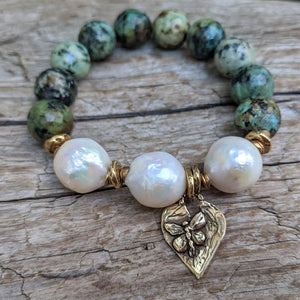 Large white pearl and African turquoise elastic bracelet with heart and butterfly charm by Aurora Creative Jewellery