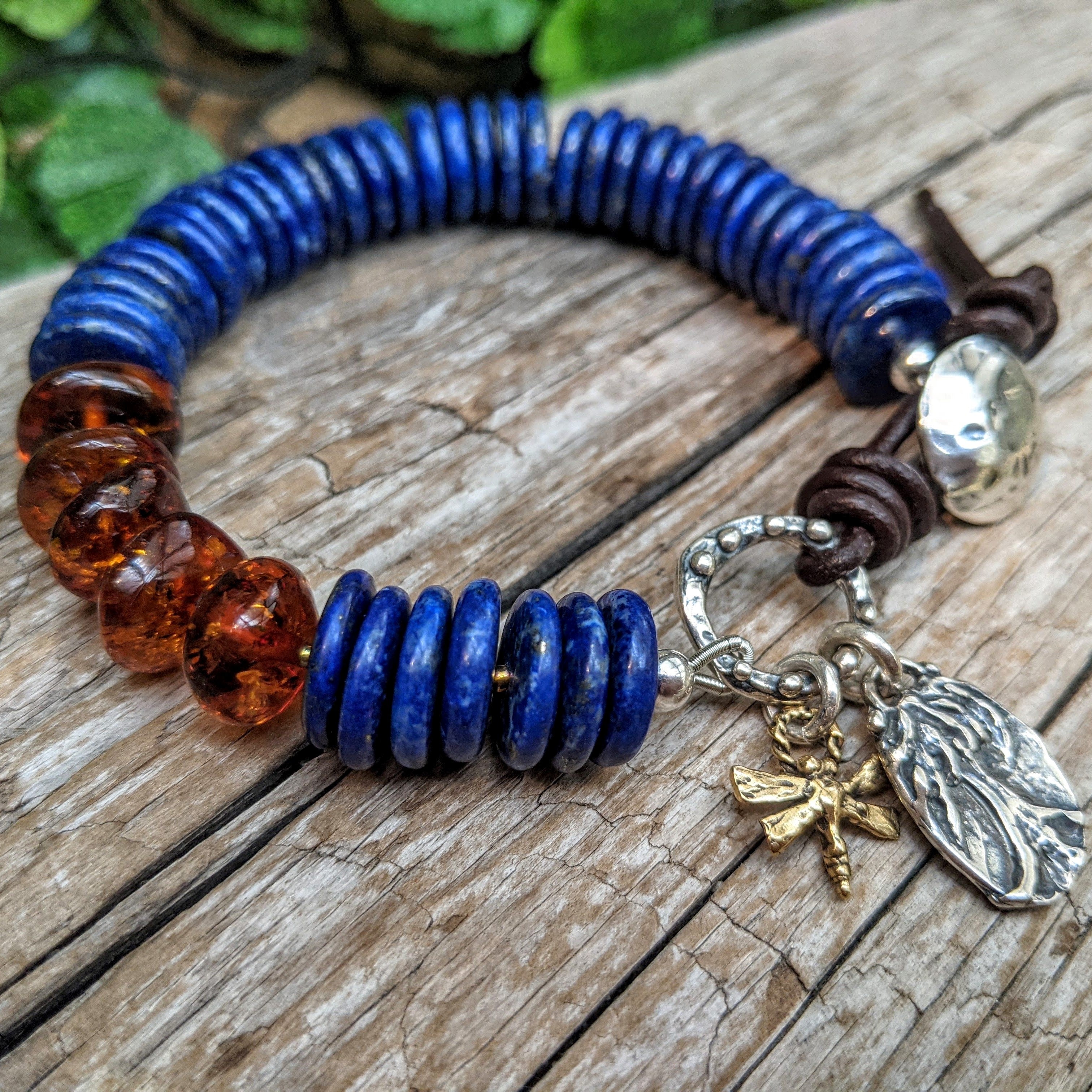 Lapis lazuli bracelet with Baltic amber , sterling silver and gold bronze.