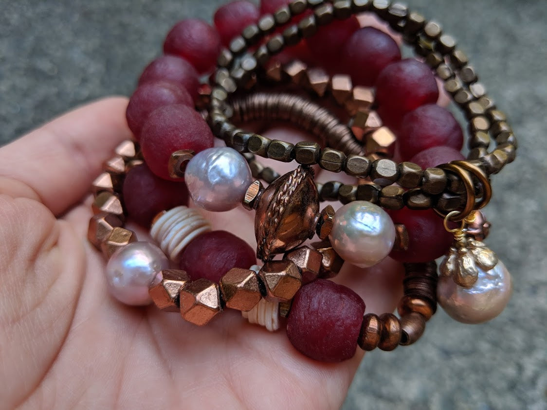 Burgundy recycled glass elastic bracelet with soft pink Edison pearls. Beautiful to wear on its own or in a stack! By Aurora Creative Jewellery