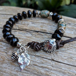 Smoky quartz forest bracelet with silver leaf and pine cone, by Aurora Creative Jewellery