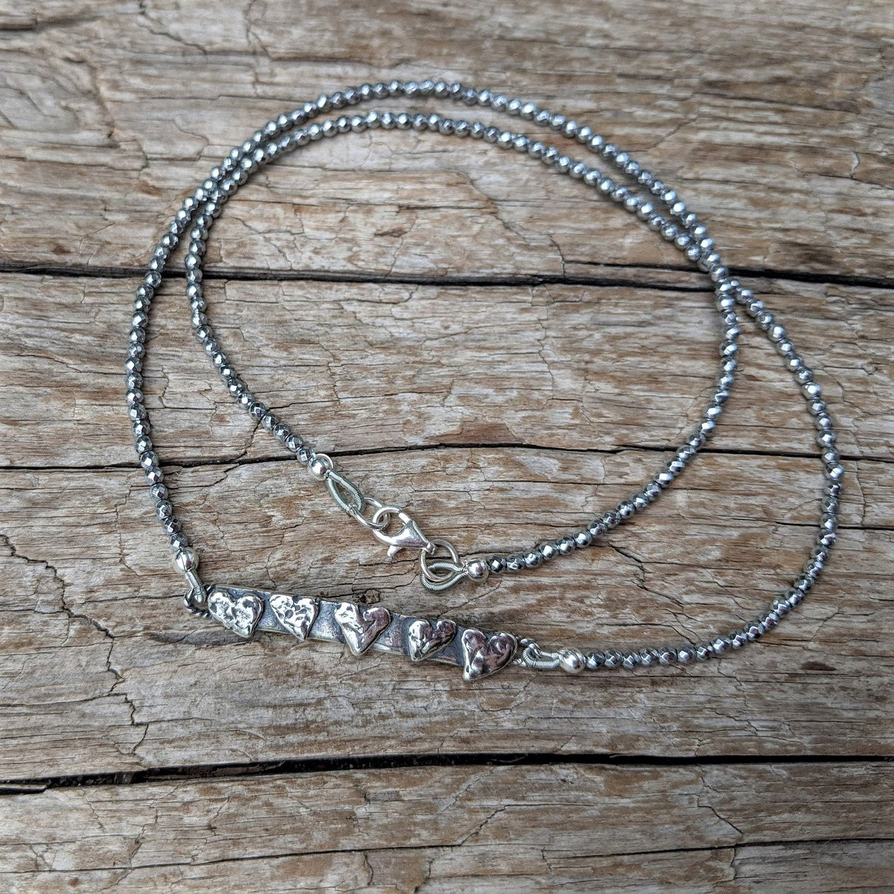 Silver hearts and silver hematite thin dainty gemstone necklace by Aurora Creative Jewellery