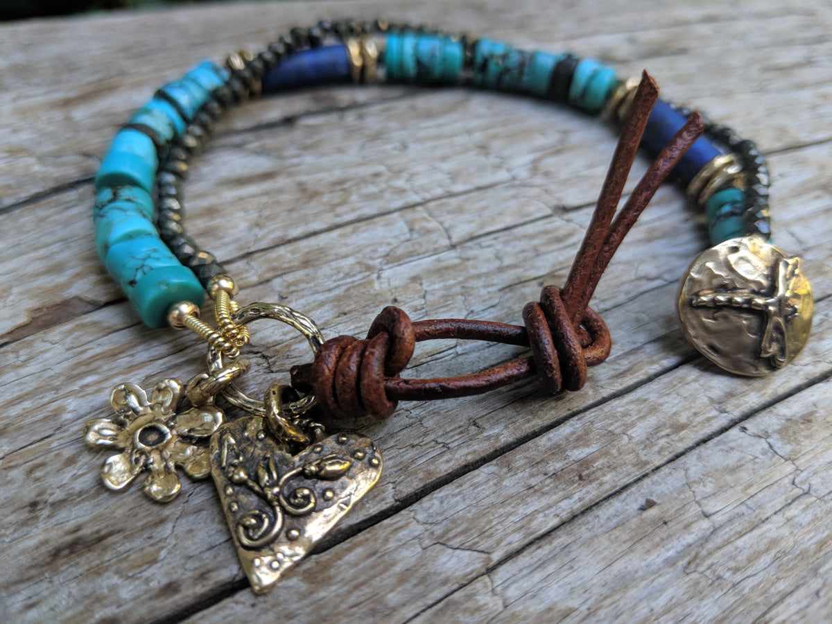 Tibetan turquoise, lapis lazuli, and pyrite bracelet with flower & heart charms, dragonfly button and leather, by Aurora Creative Jewellery