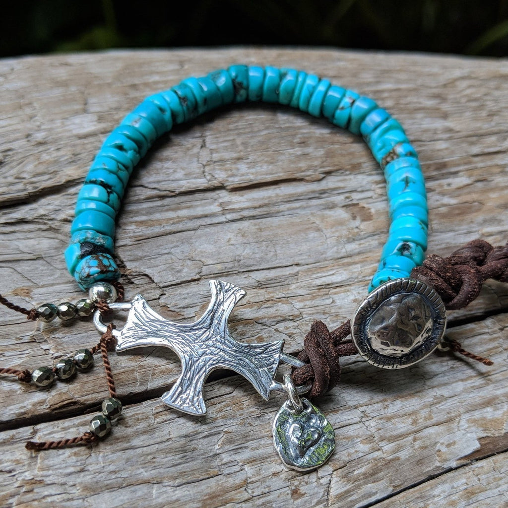 Tibetan turquoise bracelet with silver spanish cross, heart charm, pyrite, leather and button, by Aurora Creative Jewellery