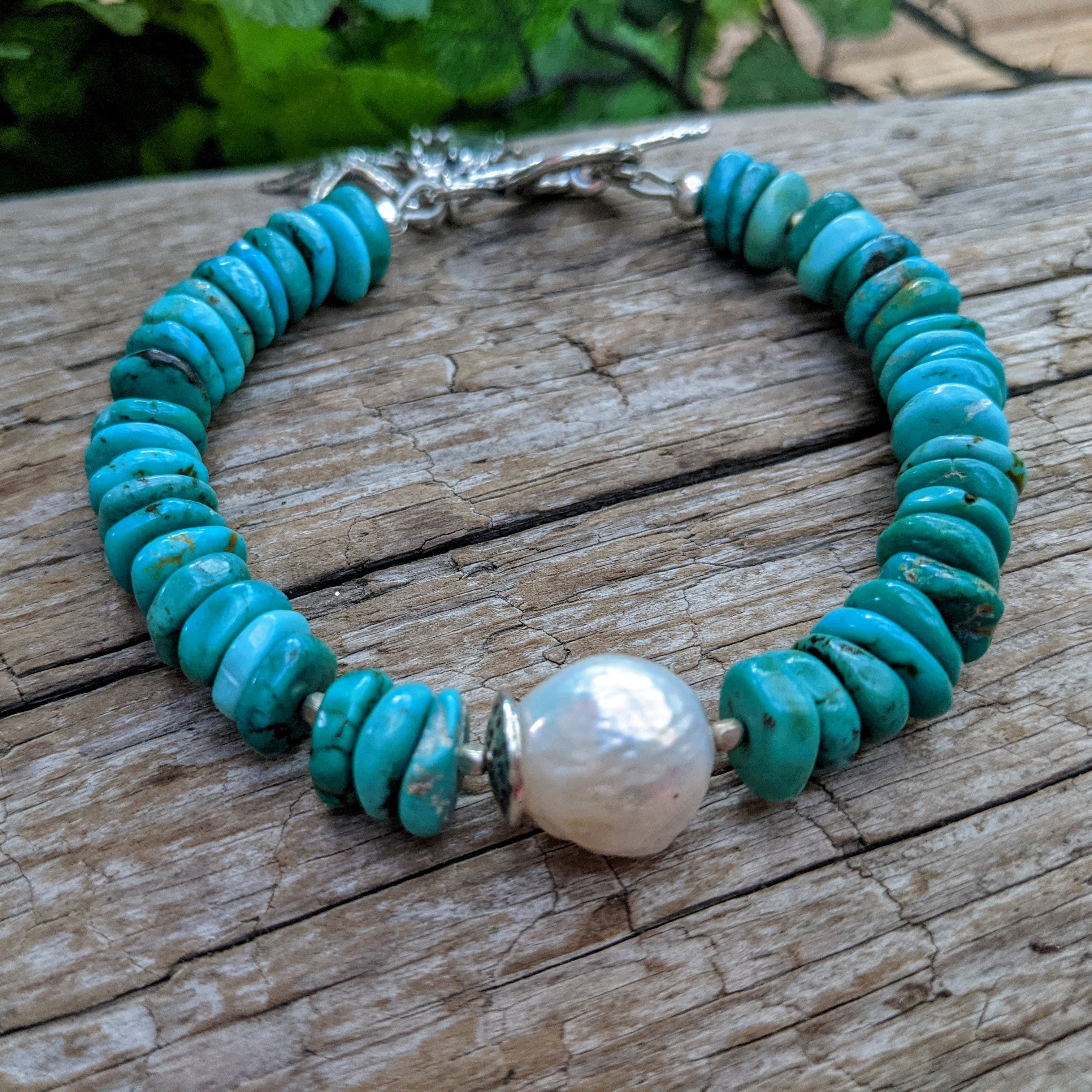 Turquoise & pearl ocean theme bracelet. Seahorse & sea star charm bracelet. Gemstone charm bracelet. Unique artisan jewelry. Artistic jewelry. Handcrafted by Aurora Creative Jewellery. 
