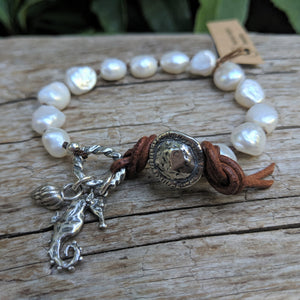 Large white baroque pearl button handmade artisan bracelet with silver seahorse and sea shell charms by Aurora Creative Jewellery